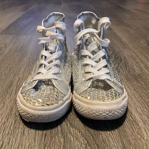 Silver sequin high top sneakers.